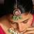 Traditional kundan necklace set with green beads and red accents
