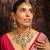 Traditional kundan necklace set with green beads and red accents