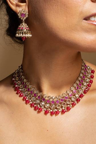 Elegant pink and gold kundan necklace set with matching earrings