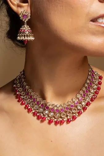 Elegant pink and gold kundan necklace set with matching earrings
