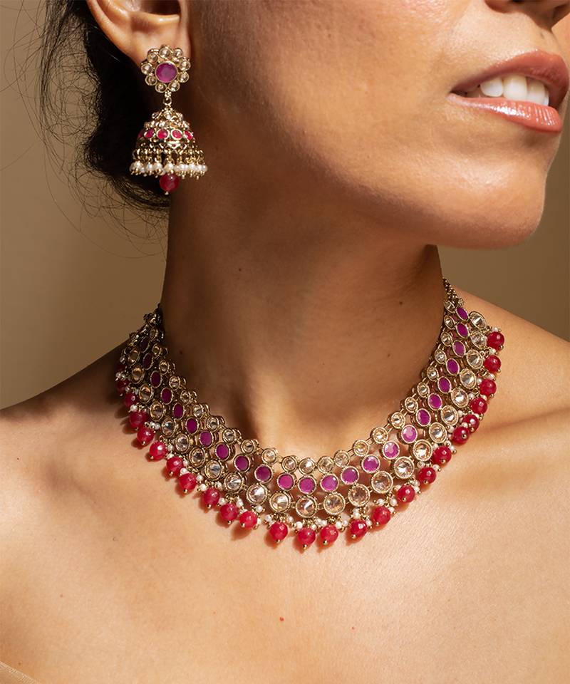 Elegant pink and gold kundan necklace set with matching earrings