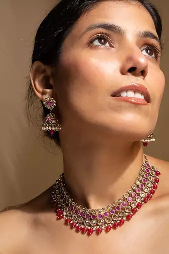 Elegant pink and gold kundan necklace set with matching earrings