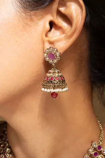Elegant pink and gold kundan necklace set with matching earrings