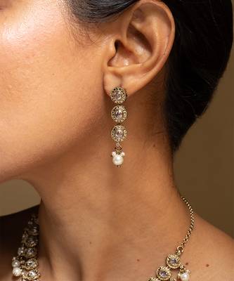 Elegant gold-toned traditional necklace and earring set with pearl accents 2