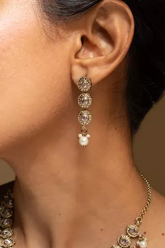 Elegant gold-toned traditional necklace and earring set with pearl accents