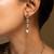 Elegant gold-toned traditional necklace and earring set with pearl accents