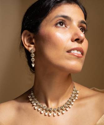 Elegant gold-toned traditional necklace and earring set with pearl accents 3
