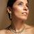 Elegant gold-toned traditional necklace and earring set with pearl accents