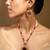 Ruby red beaded necklace set with statement pendant