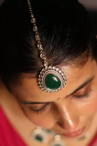 Statement green stone necklace set with kundan accents