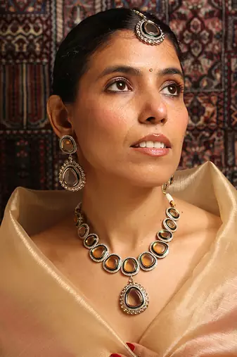 Elegant polki necklace set with champagne stones