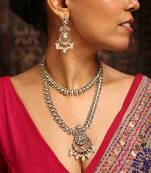 Stunning gold-toned diamond necklace set with clear stones and pearl drops