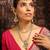 Stunning gold-toned diamond necklace set with clear stones and pearl drops