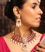 Traditional red stone choker necklace set with pearls and maang tikka