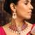 Traditional red stone choker necklace set with pearls and maang tikka