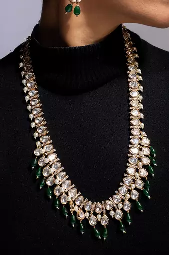 Traditional long kundan haram with green bead accents