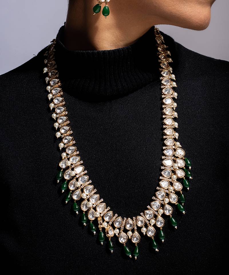 Traditional long kundan haram with green bead accents