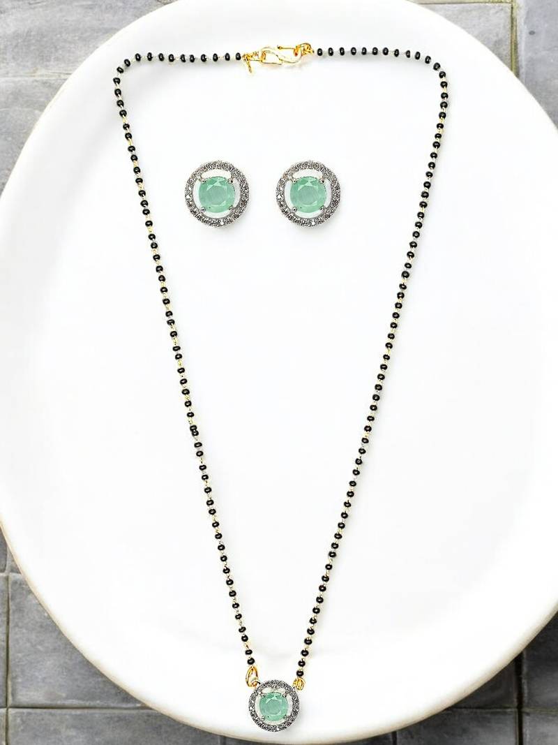 Gold plated black beaded sea green ad stone mangalsutra with earrings
