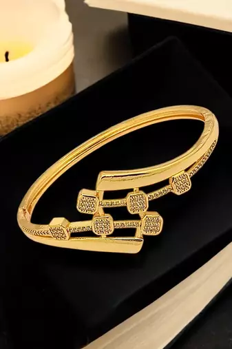 Gold plated statement kada bracelet