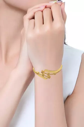Gold plated statement kada bracelet