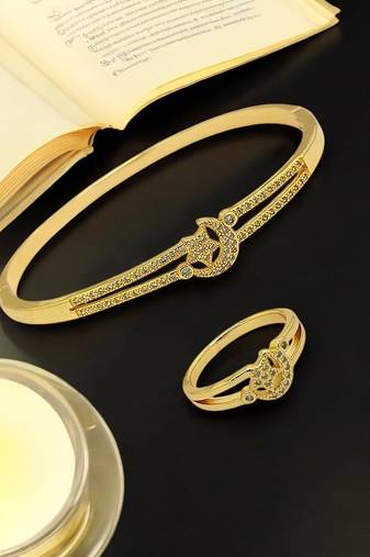 Gold plated cubic zircon studded star & moon design bracelet with ring