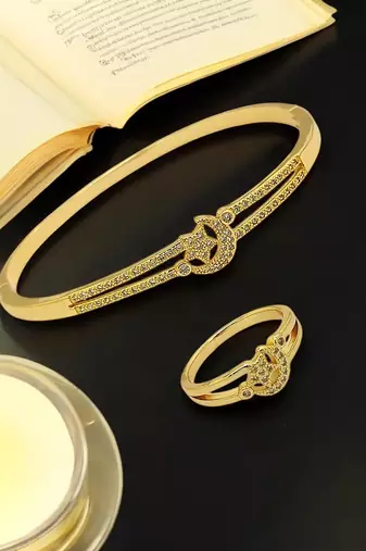 Gold plated cubic zircon studded star & moon design bracelet with ring