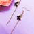 Gold tone bohemian style dangle earrings with black enamel pendants earrings