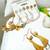 Golden cascade: gold-plated tassel and pearl fusion stud and hoop earring ensemble