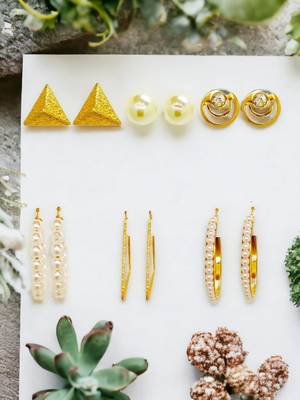 Radiant harmony: luxurious gold-plated and pearl fusion stud and hoop earring collection 1