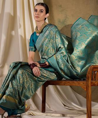 Striking teal banarasi silk saree with weaving details 1