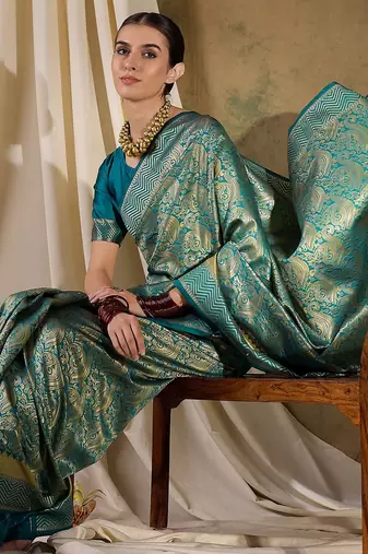 Striking teal banarasi silk saree with weaving details