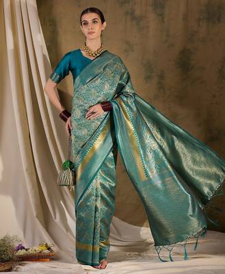 Striking teal banarasi silk saree with weaving details 3