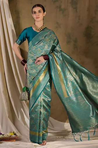 Striking teal banarasi silk saree with weaving details