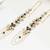 Black & gold kundan pearl earrings with ear chain