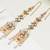 Orange kundan dangler earrings with ear chain