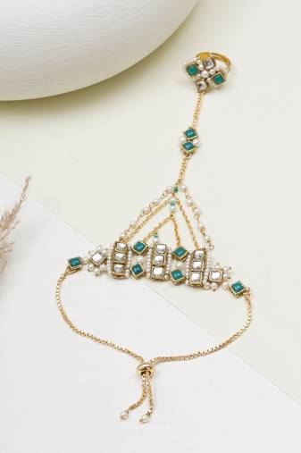 Gold-plated haathphool with emerald accents