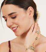Gold-plated haathphool with emerald accents