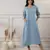 Women smoke blue v-neck dress