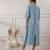 Women smoke blue v-neck dress