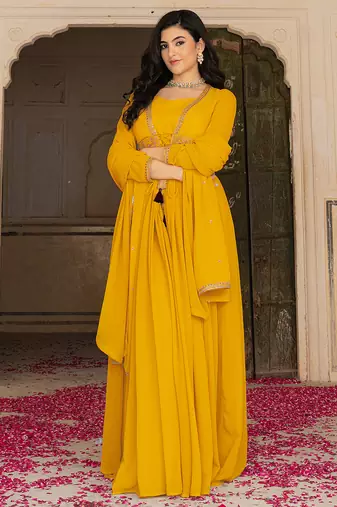 Radiant mustard yellow georgette embroidered gown with dupatta for festive elegance