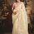 Designer cream tissue organza saree with all over butta work & heavy stone embellished border