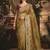 Designer golden tissue organza saree with all over butta work & heavy stone embellished border