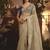 Designer beige tissue organza saree with all over butta work & heavy stone embellished border