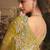Designer mustard tissue organza saree with all over butta work & heavy stone embellished border