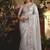 Designer light grey tissue organza saree with all over butta work & heavy stone embellished border