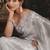 Designer light grey tissue organza saree with all over butta work & heavy stone embellished border