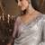 Designer light grey tissue organza saree with all over butta work & heavy stone embellished border