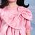 Pink embroidered satin dress paired with jacket