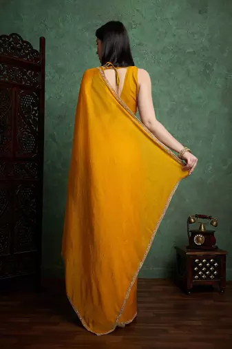 Yellowcolor fendy chiffon saree with running blouse