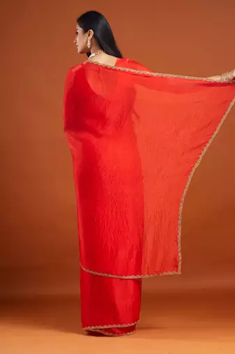 Red color fendy chiffon saree with running blouse